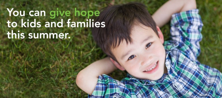 Smiling boy with text that reads, "You can give hope to kids and families this summer."